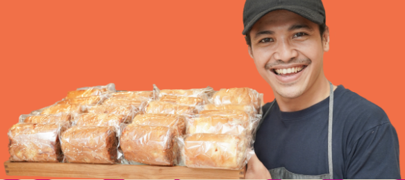 Smiling Man Holding a Tray of Sandwiches